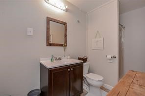 896 Davis Road League City, TX 77573 - Photo 44 of 46 a bathroom with a toilet sink and mirror