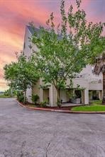 896 Davis Road League City, TX 77573 - Photo 9 of 46 a front view of a house with a yard and potted plants