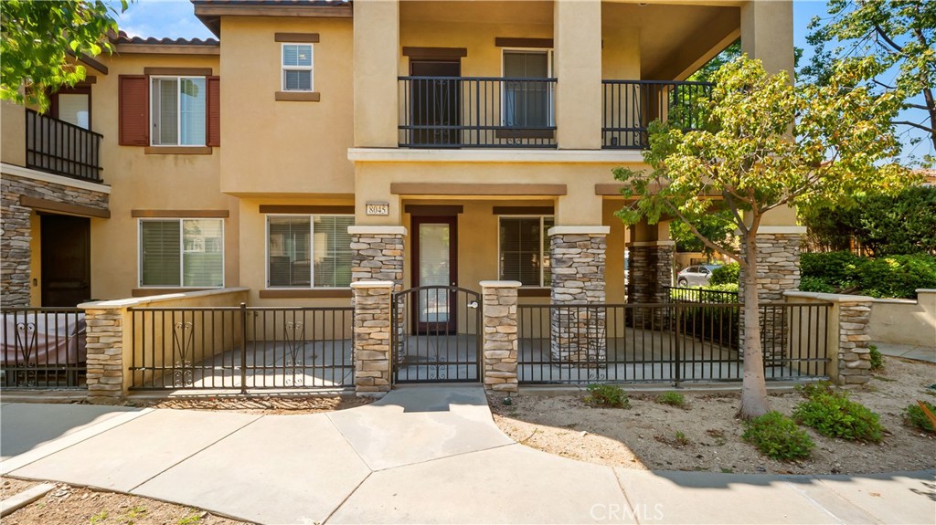 8045 Cresta Bella Road Rancho Cucamonga, CA 91730 - Photo 1 of 1 a view of a house with a small yard and wooden fence