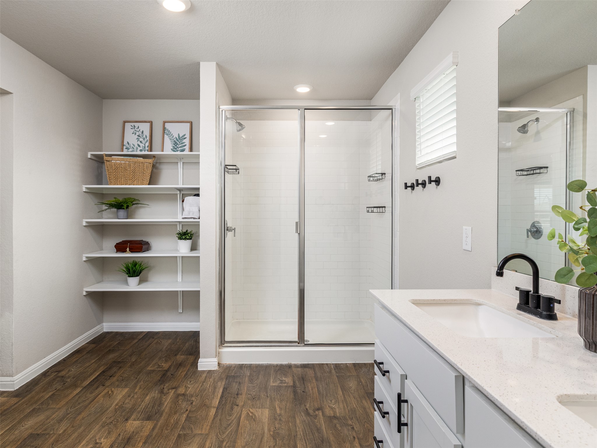 439 Hunter Loop Bertram, TX 78605 - Photo 16 of 23 Ample storage and modern fixtures elevate this well-appointed bathroom space.