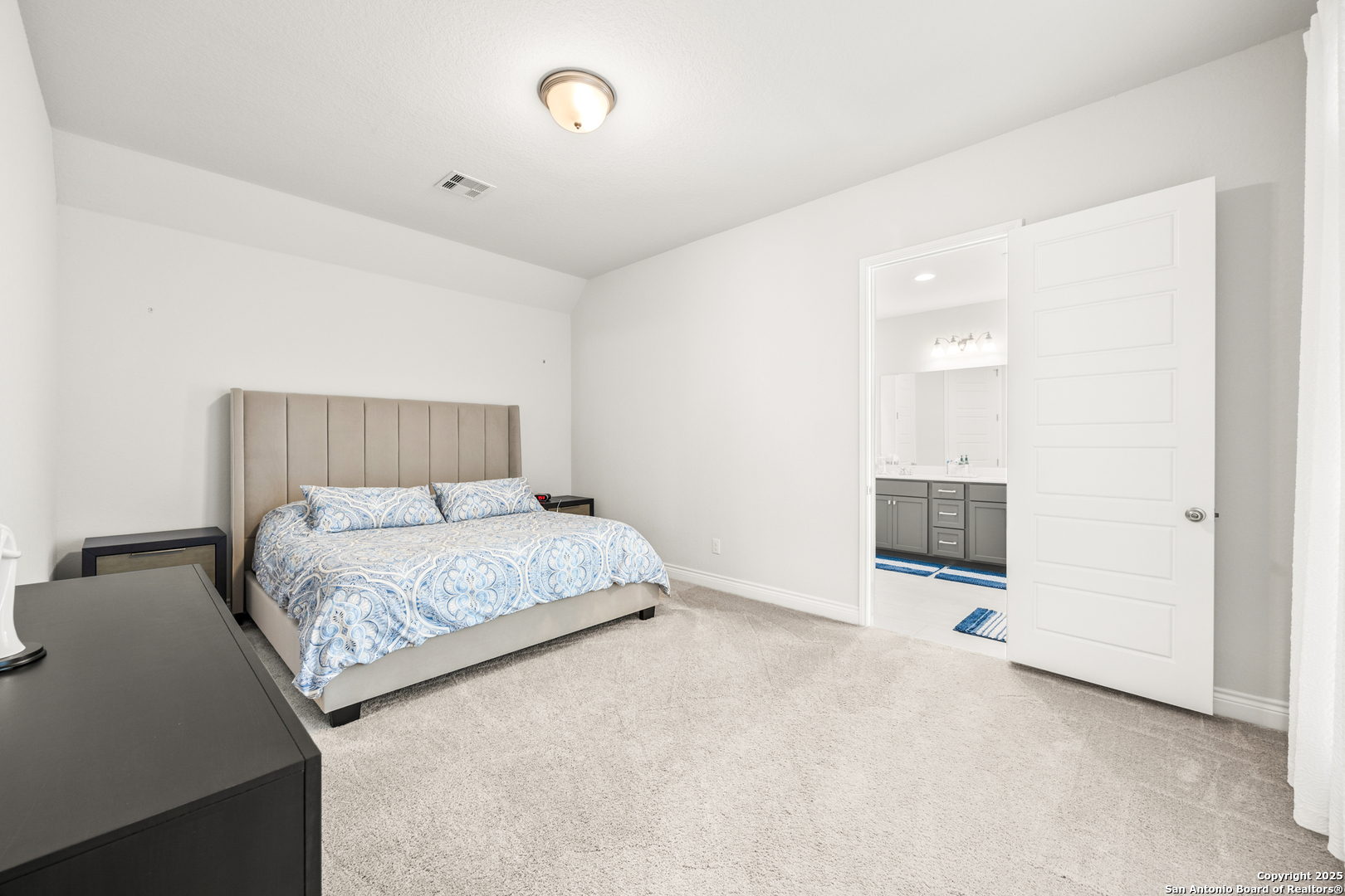 2108 Calate Ridge San Antonio, TX 78253 - Photo 13 of 25 a bedroom with a bed and painting on the wall