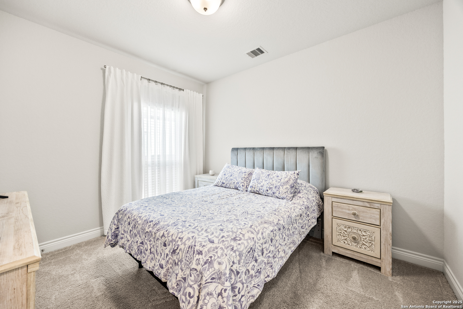 2108 Calate Ridge San Antonio, TX 78253 - Photo 15 of 25 a bedroom with a bed and a window