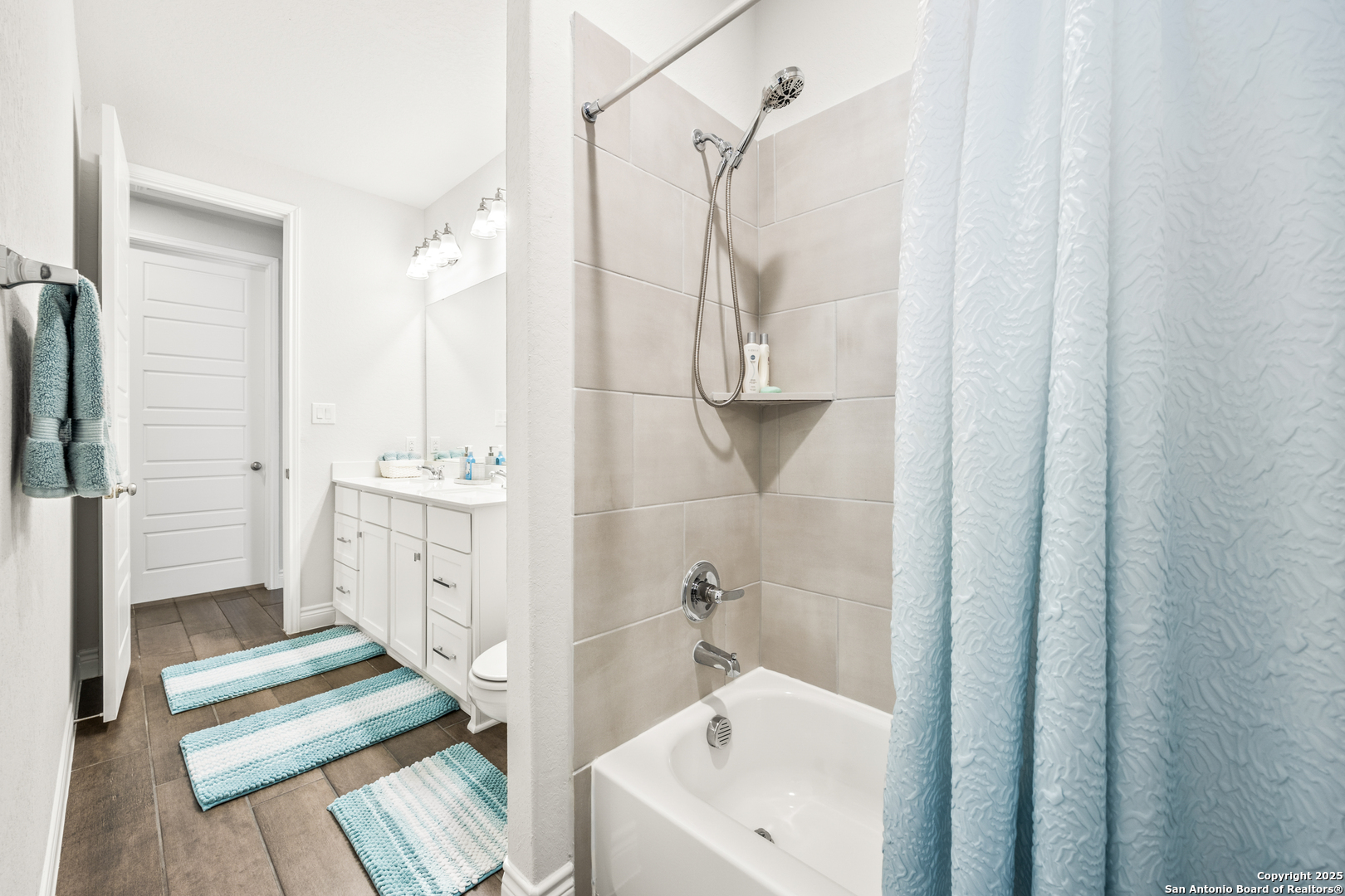 2108 Calate Ridge San Antonio, TX 78253 - Photo 17 of 25 a bathroom with a sink a mirror and a shower