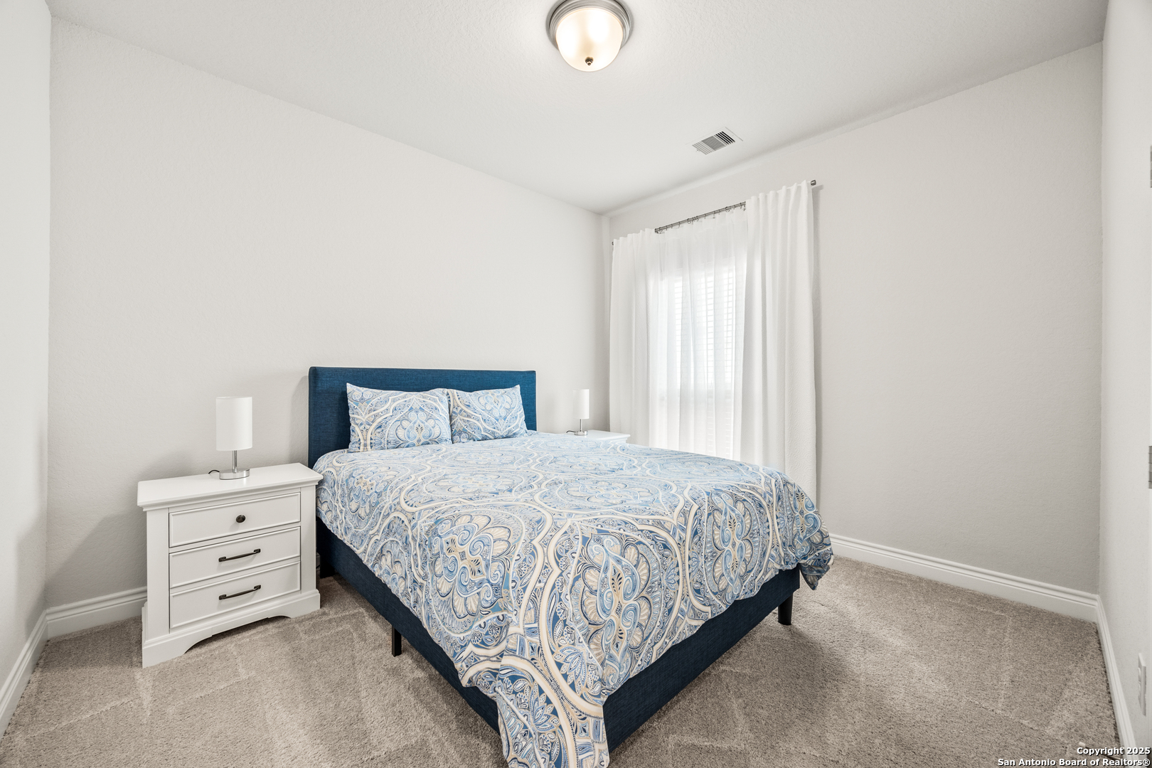 2108 Calate Ridge San Antonio, TX 78253 - Photo 18 of 25 a bedroom with a bed and a window