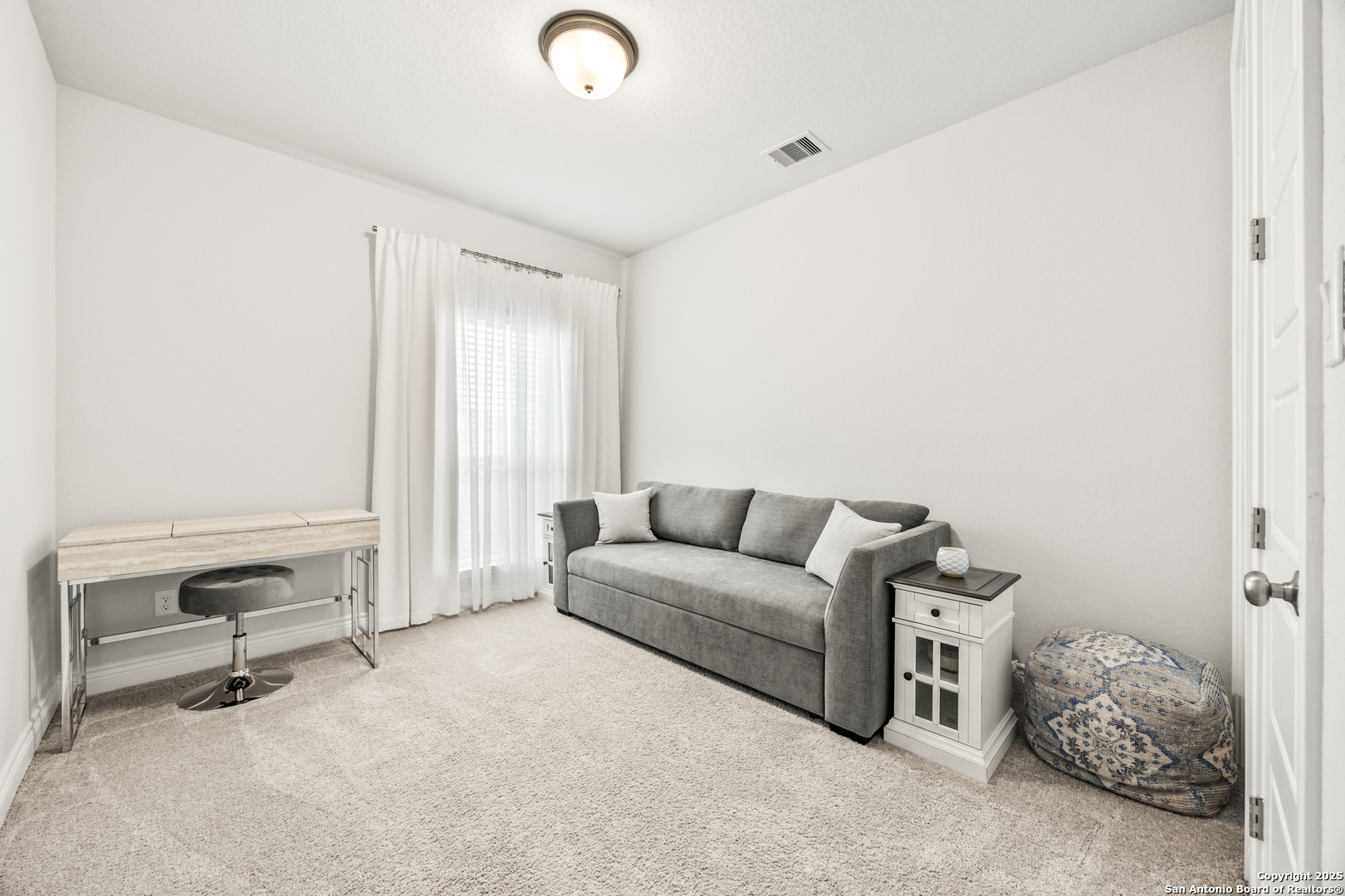 2108 Calate Ridge San Antonio, TX 78253 - Photo 19 of 25 a living room with furniture a couch and a window