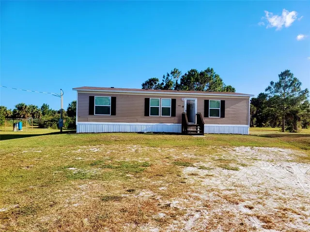 a view of a house with a swimming pool