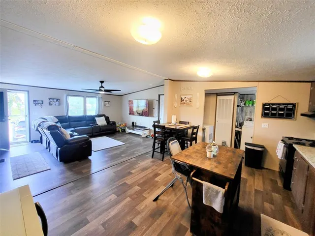 a view of a room with wooden floor
