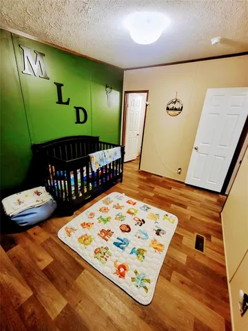 a view of a livingroom with furniture and flat screen tv