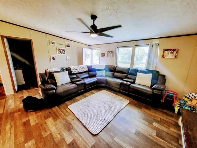 an aerial view of residential houses with yard