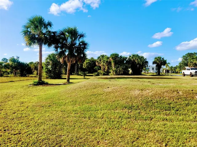 a view of a swimming pool with an outdoor space and seating area