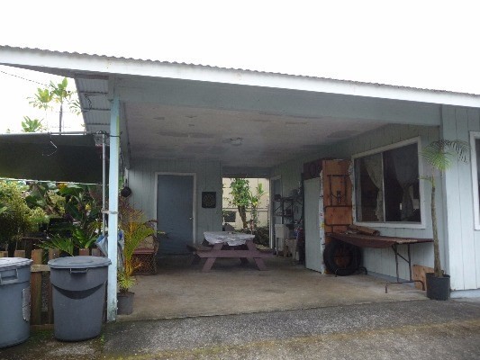 17-1158 Volcano Road Mountain View, HI 96771 - Photo 3 of 12 a view of a patio with table and chairs