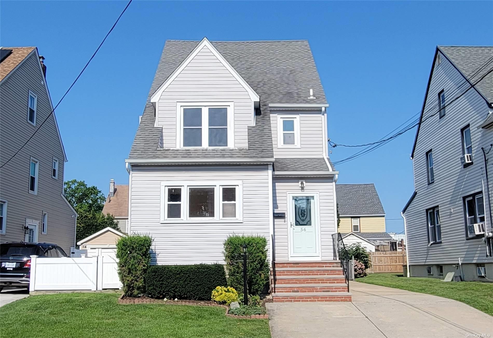 56 Marlboro Road Valley Stream, NY 11581 - Photo 1 of 1 a front view of a house with a yard