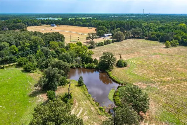 a view of a lake with a yard