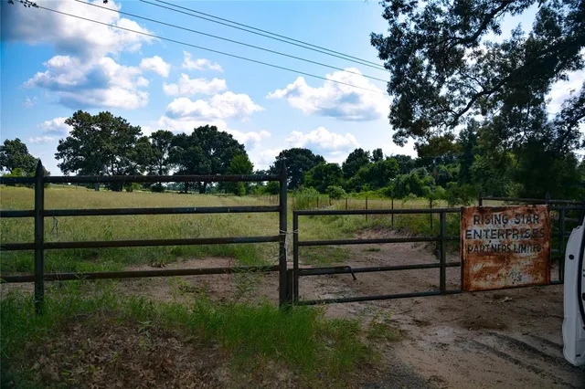 a view of park with iron fence