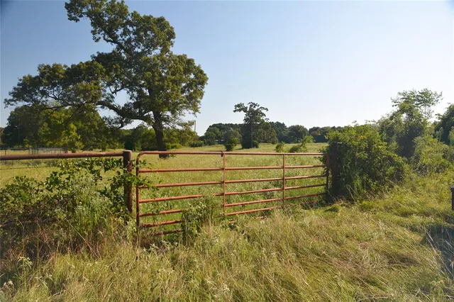 a view of lake with green space