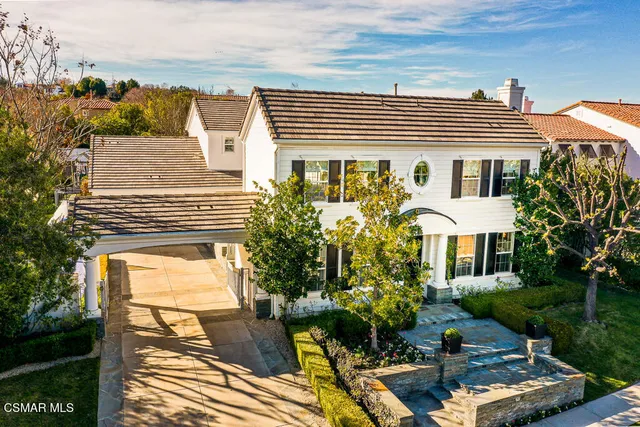 a view of a chairs and fire pit in the patio