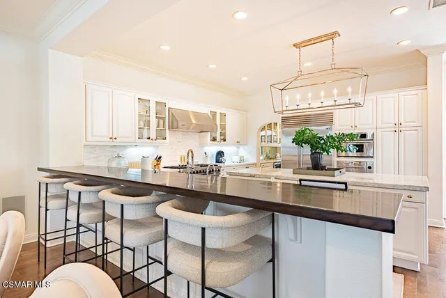 a kitchen with granite countertop a sink and stove