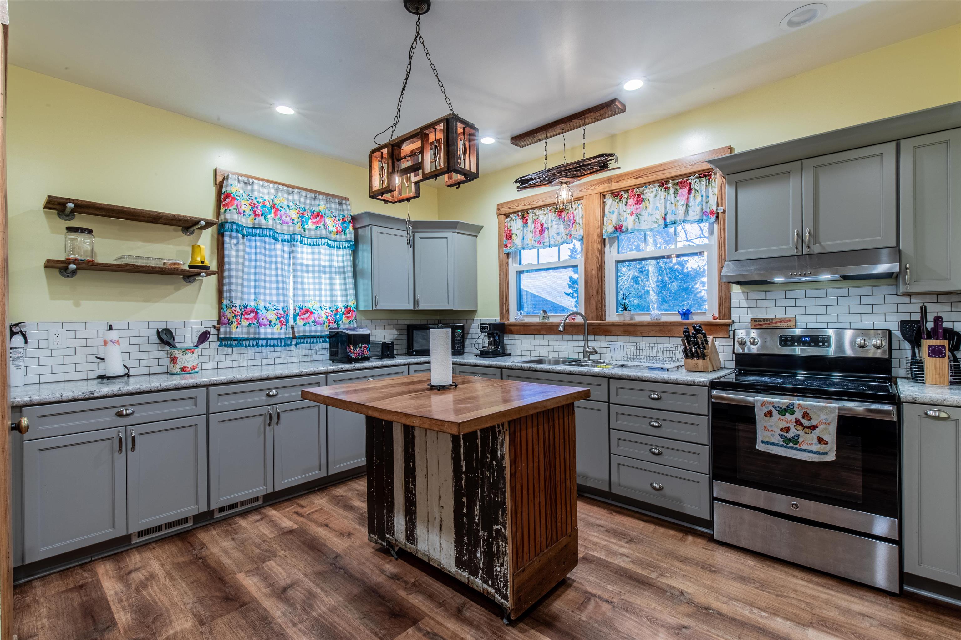 72 North Main Street La Moille, IL 61330 - Photo 13 of 31 a kitchen with a sink stove and cabinets