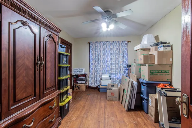 a view of a livingroom with furniture and hardwood floor