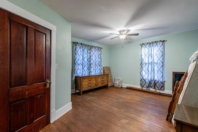 wooden floor with a window in a room