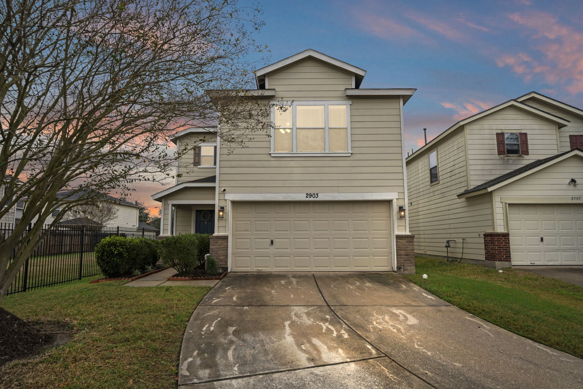 2903 Valiant Scene Court Houston, TX 77038 - Photo 13 of 19 a front view of a house with a yard