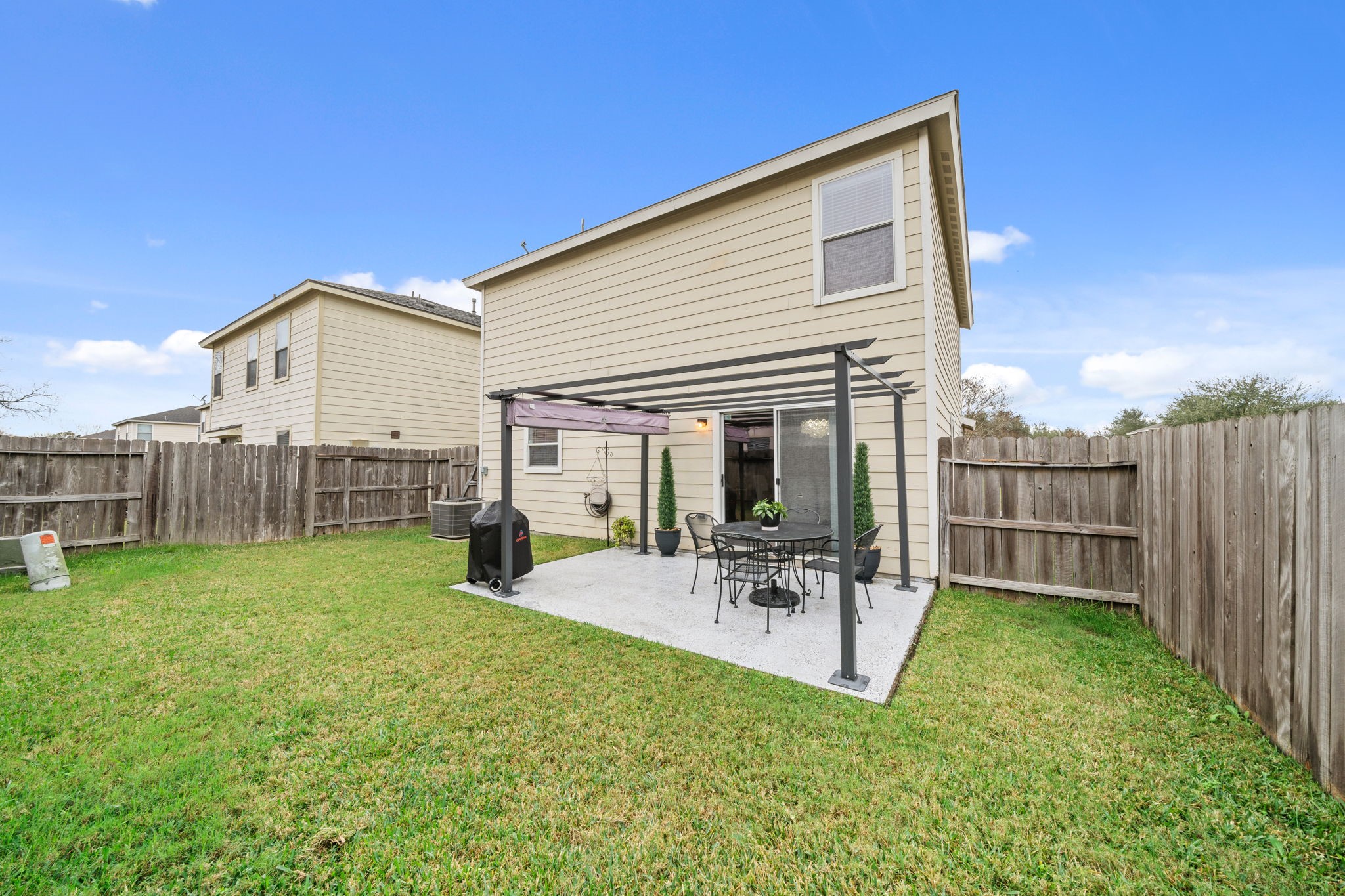 2903 Valiant Scene Court Houston, TX 77038 - Photo 16 of 19 a view of a house with backyard and porch