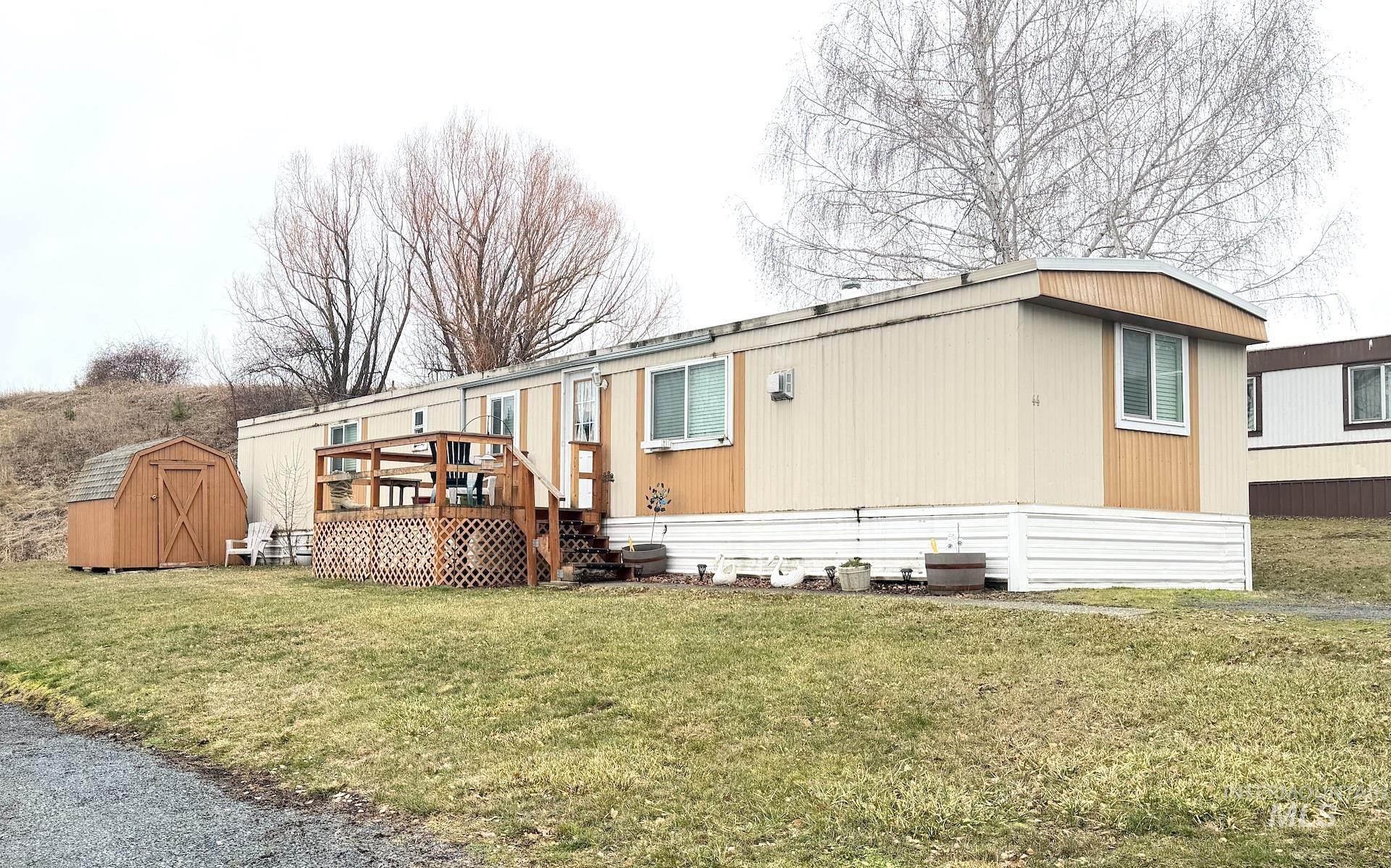 4325 Lenville Road, Unit 44 Moscow, ID 83843 - Photo 1 of 20 View of front facade with a shed, a front yard, and a deck