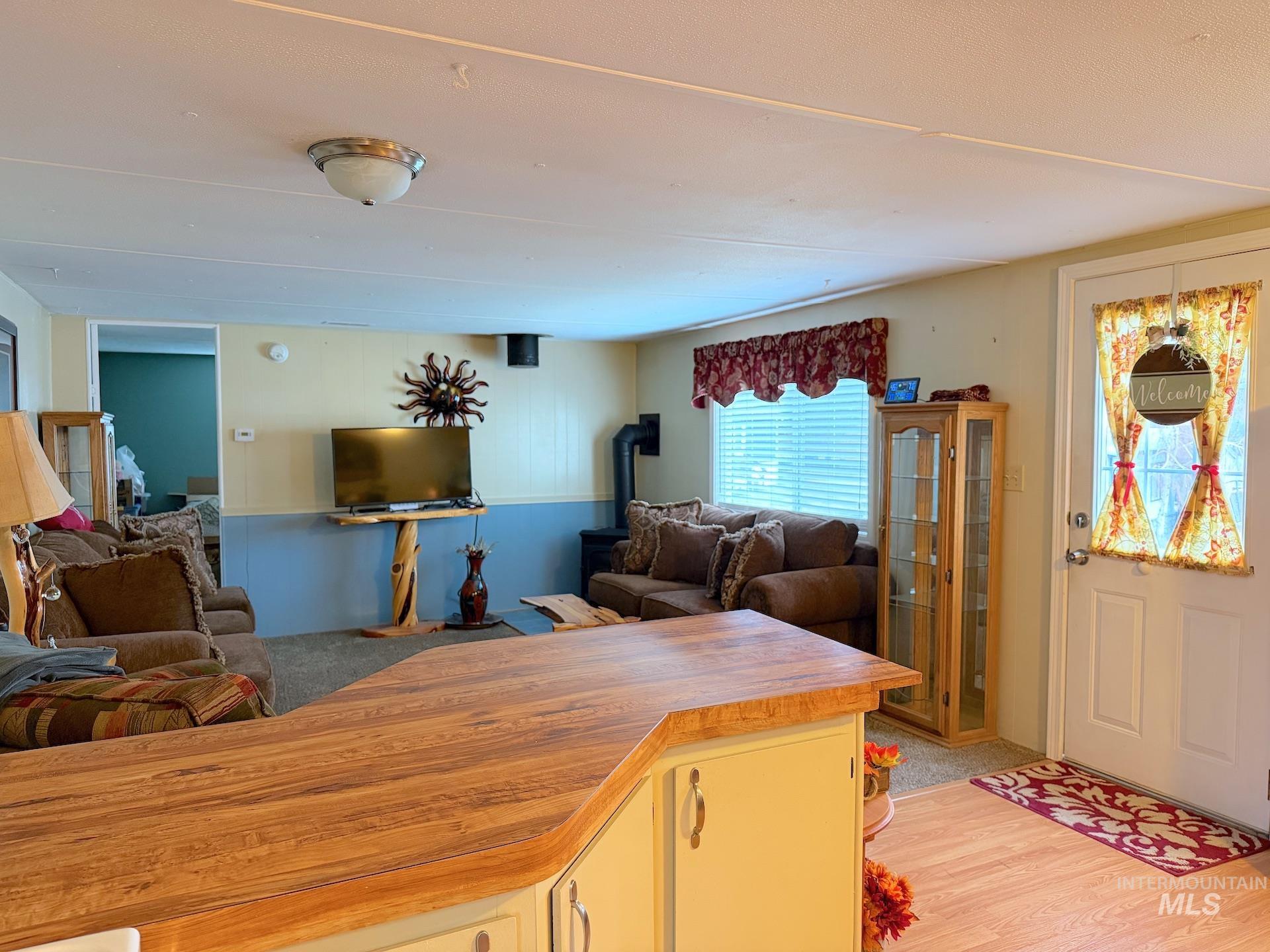 4325 Lenville Road, Unit 44 Moscow, ID 83843 - Photo 3 of 20 Living room with light wood-type flooring and a wood stove