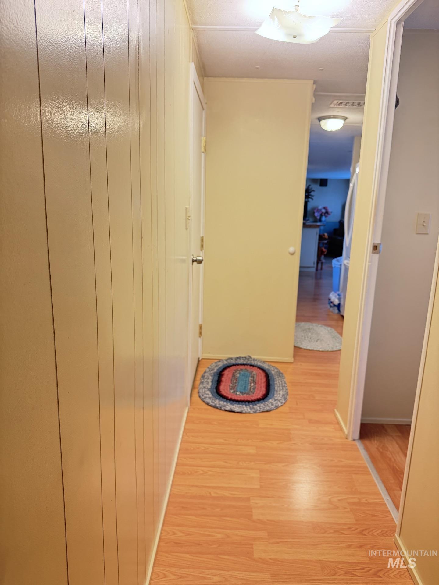 4325 Lenville Road, Unit 44 Moscow, ID 83843 - Photo 9 of 20 Hallway featuring light wood-type flooring and baseboards