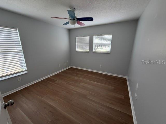 1885 Scrub Jay Road Apopka, FL 32703 - Photo 21 of 29 wooden floor in an empty room with a window