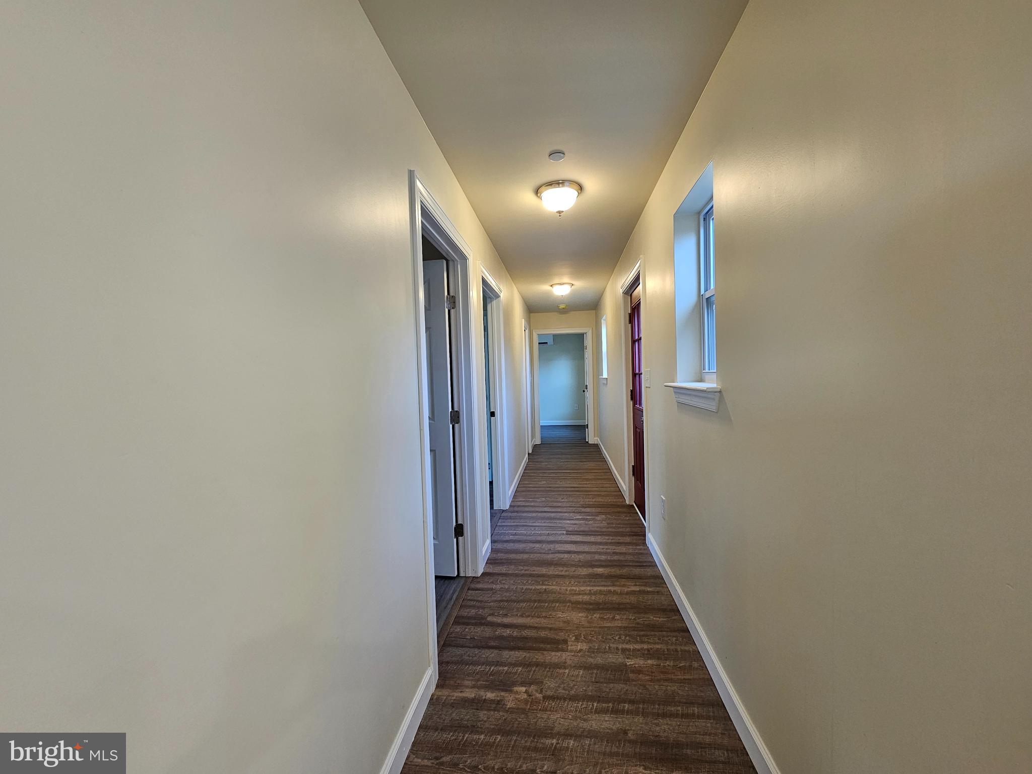 26404 Franklin Road Crisfield, MD 21817 - Photo 15 of 31 a view of a hallway with wooden floor