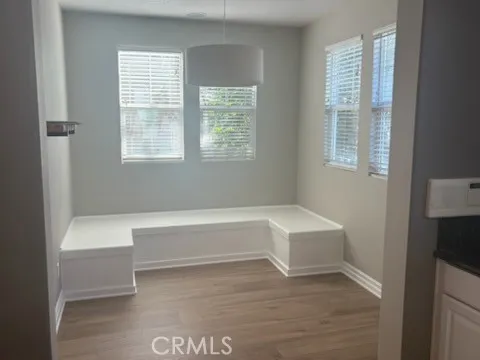 a bathroom with a bathtub a window and a shower