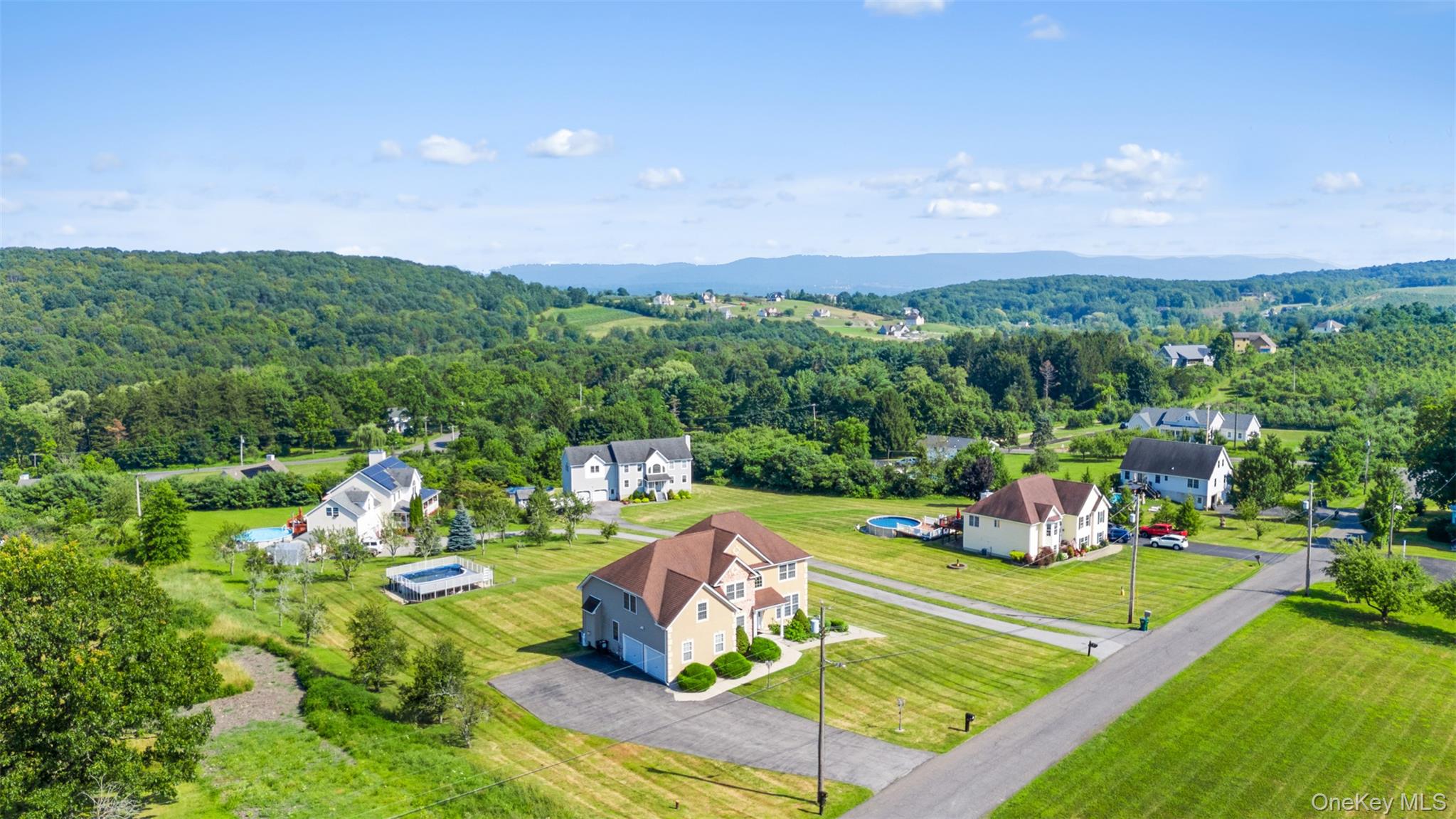 14 Burma Road Marlboro, NY 12542 - Photo 2 of 30 a view of a swimming pool with lawn chairs plants and large trees