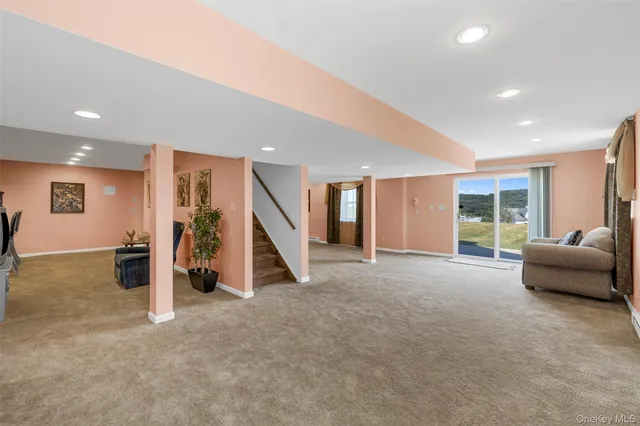 a view of a livingroom with furniture and windows