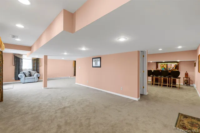 a view of a hallway with livingroom