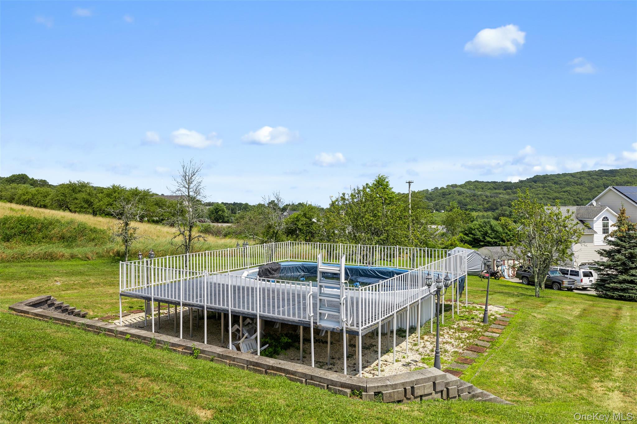 14 Burma Road Marlboro, NY 12542 - Photo 30 of 30 a view of a swimming pool with lawn chairs and plants