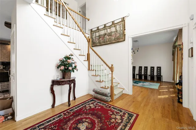 a view of an entryway with wooden floor