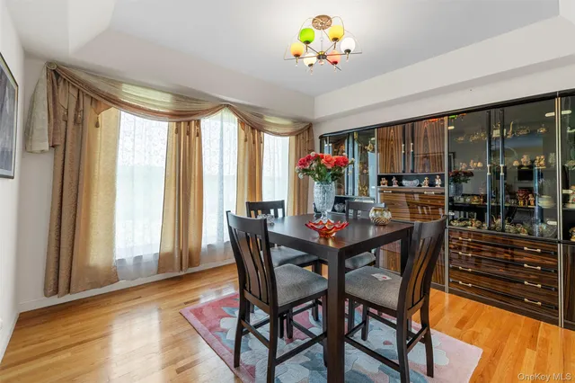 a view of a dining room with furniture and window