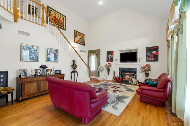 a living room with furniture fireplace and flat screen tv