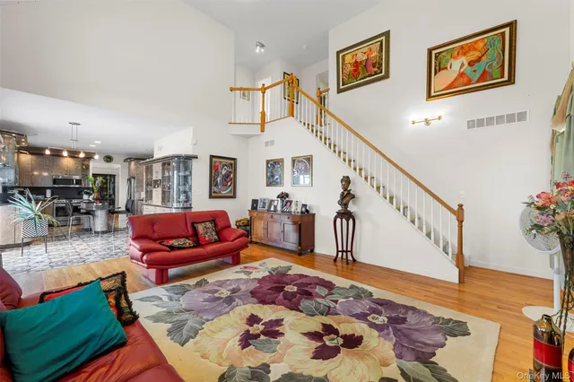 a living room with furniture and a rug
