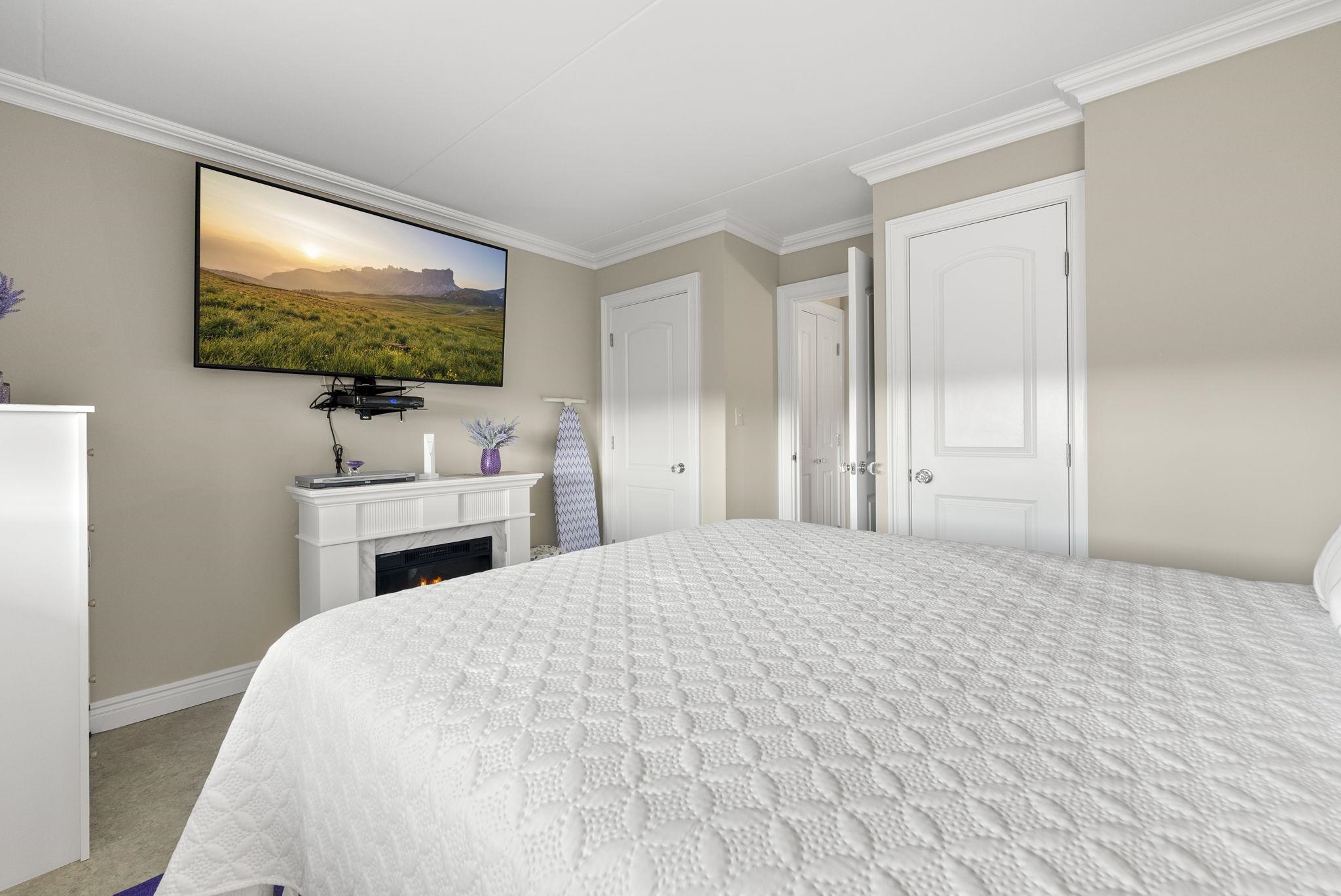 250 Gorge Road Cliffside Park, NJ 07010 - Photo 14 of 46 a bedroom with a bed and a flat screen tv