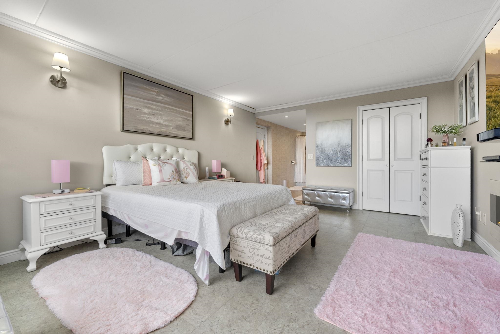 250 Gorge Road Cliffside Park, NJ 07010 - Photo 20 of 46 a spacious bedroom with a bed and ceiling fan