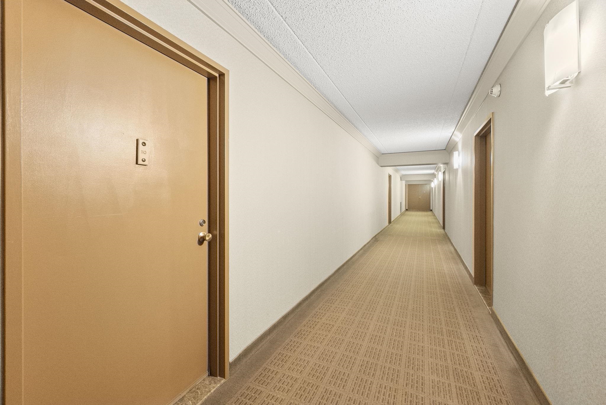 250 Gorge Road Cliffside Park, NJ 07010 - Photo 23 of 46 a view of a hallway with wooden floor and a bathroom