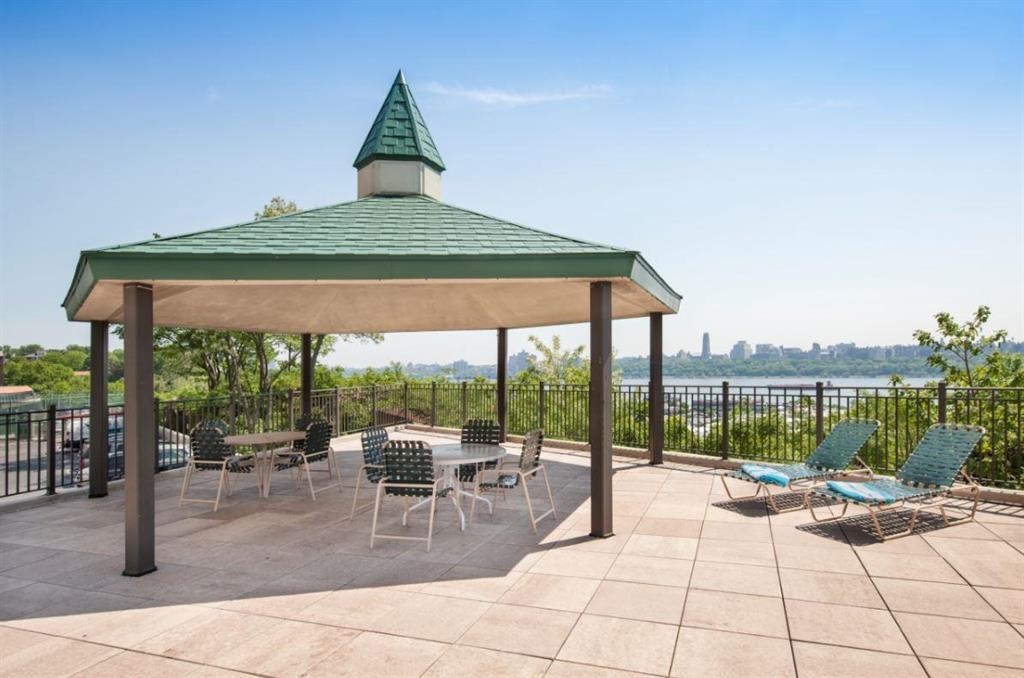 250 Gorge Road Cliffside Park, NJ 07010 - Photo 29 of 46 a view of swimming pool with outdoor seating and a patio