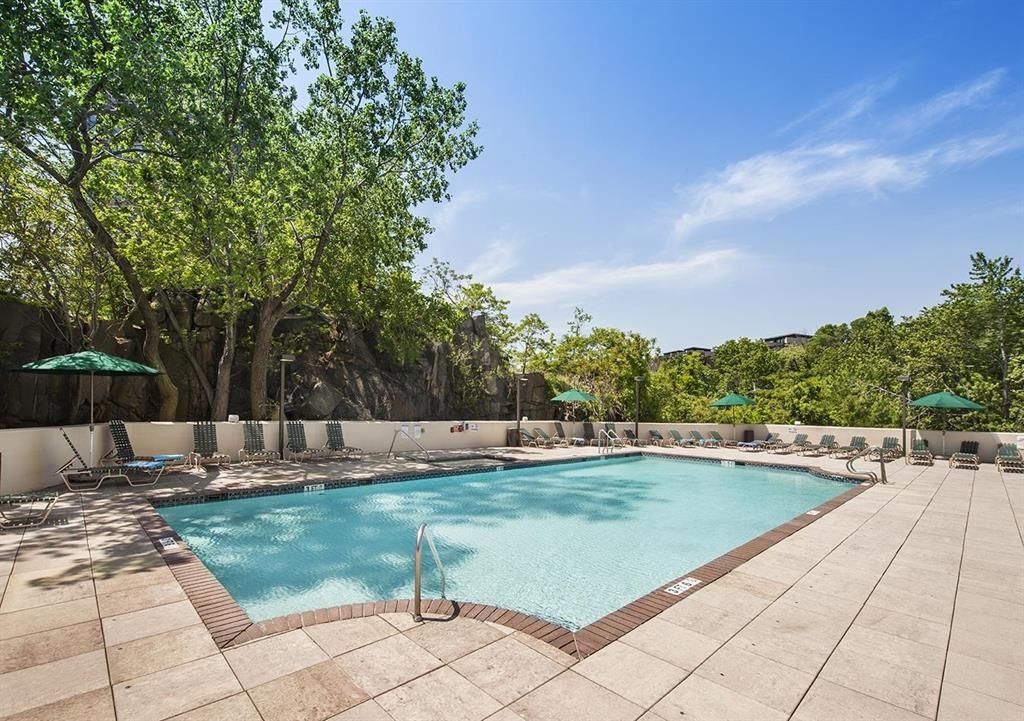 250 Gorge Road Cliffside Park, NJ 07010 - Photo 34 of 46 a view of a swimming pool with a sitting space