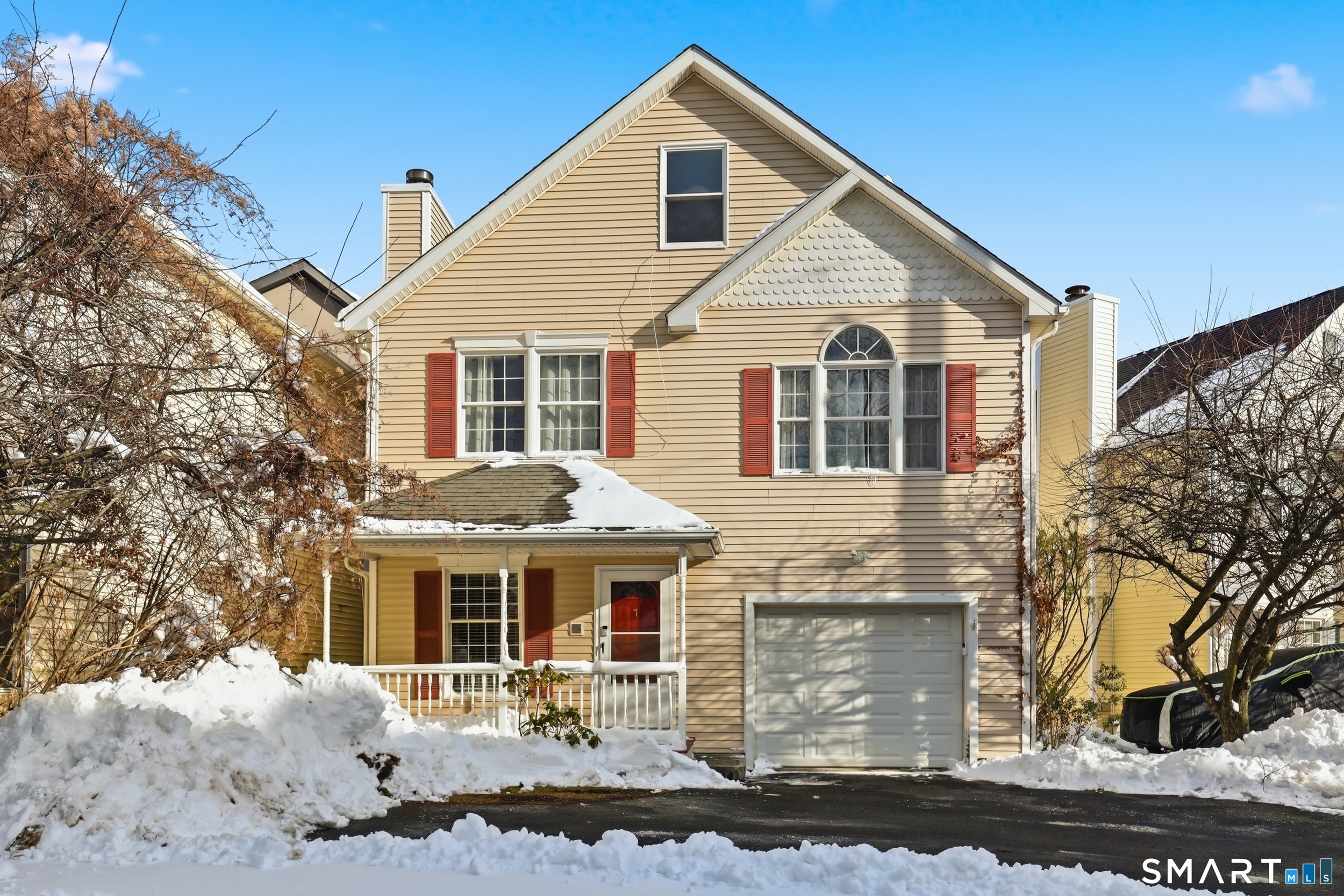 7 Dora Street, Unit 7 Stamford, CT 06902 - Photo 1 of 1 a front view of a house with a yard