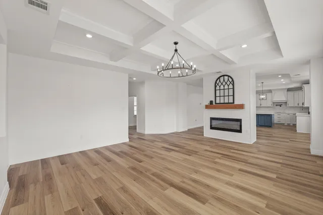 a view of kitchen appliances and wooden floor
