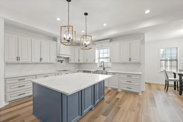 a kitchen that has a lot of cabinets in it