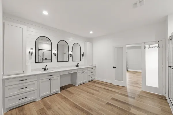 a view of a kitchen counter space and wooden floor