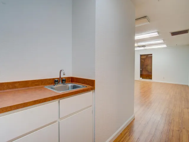 a bathroom with a sink and a window